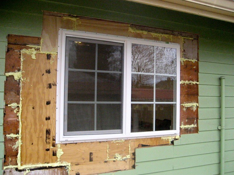 New window replaced and shows the siding around the window has been removed