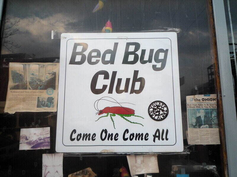 Funny sign that reads: "Bed Bug Club. Come One Come All"