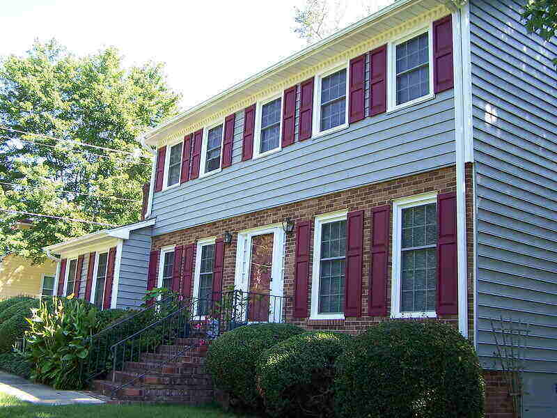 side angle of a house with siding and brick veneer