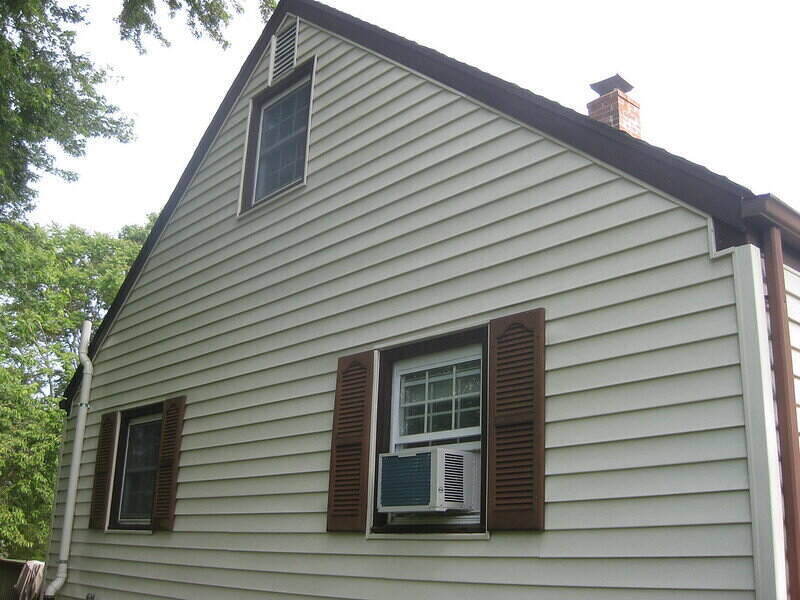 Side angle of a house with full vinyl siding