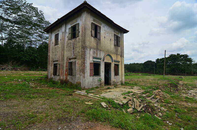 Abandoned house in the middle of a large field