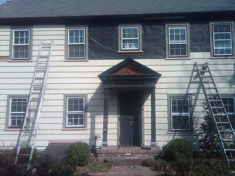 siding being repaired or replaced on a house