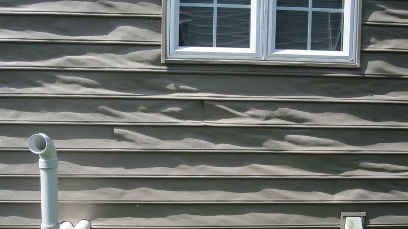 Melted vinyl siding on a house