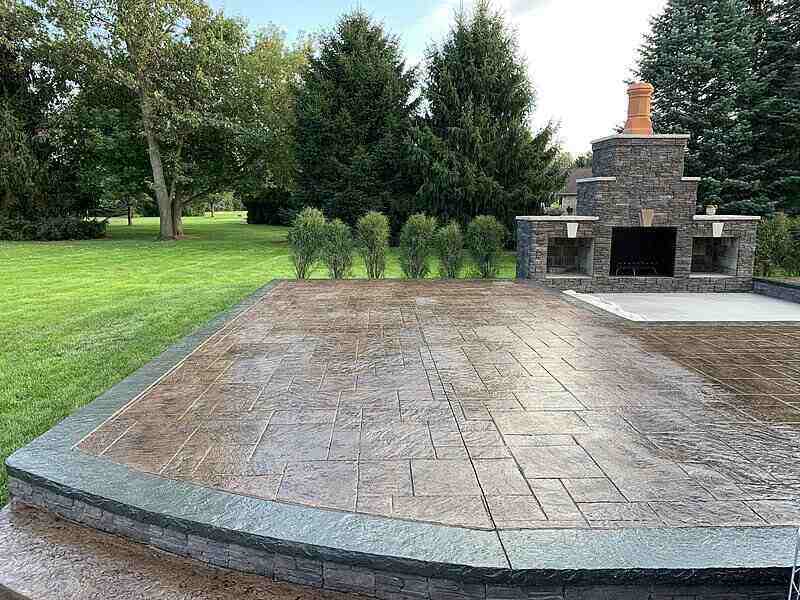 Patio with stamped concrete and stone fire oven