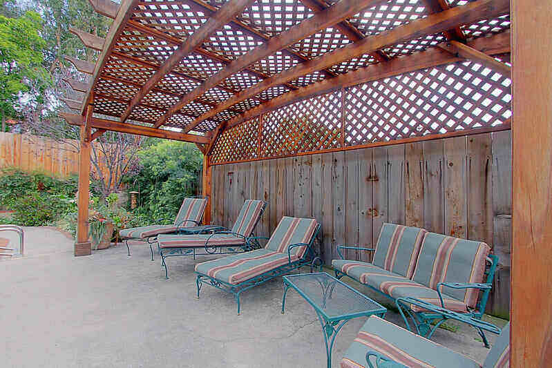 Pergola over patio furniture