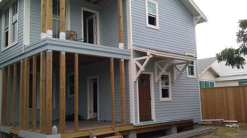 House with new siding and a second floor balcony