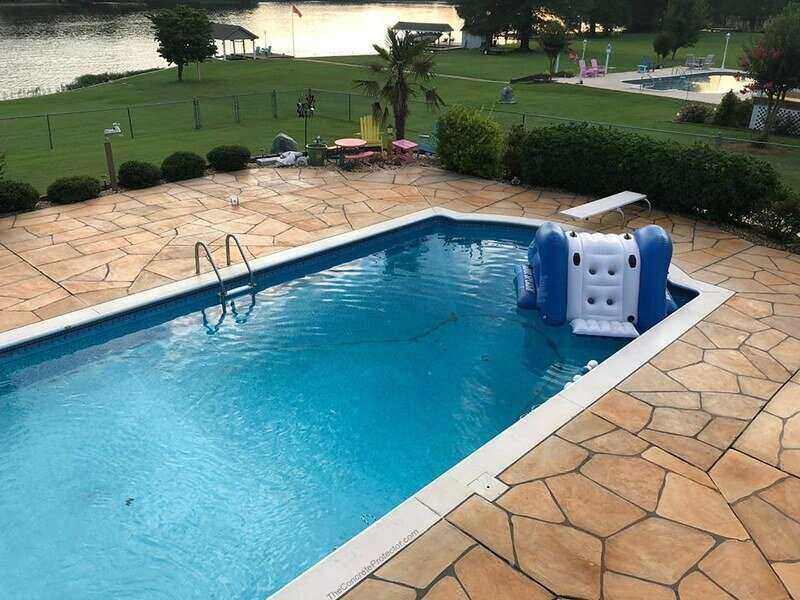 in-ground pool with pavers used for the pool deck
