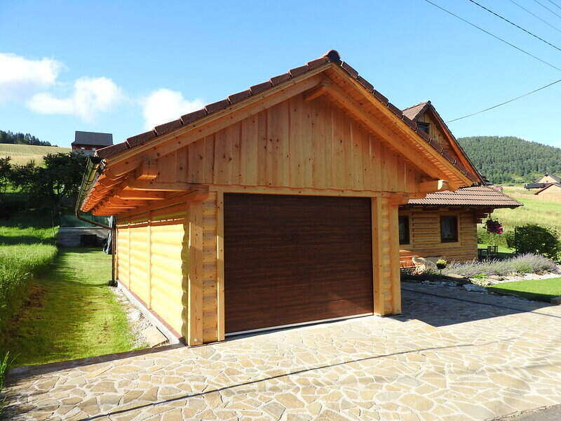 Single-car garage made from wood and beams