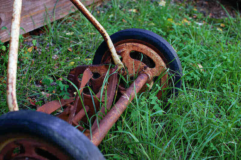 Close-up of a rusty reel mower