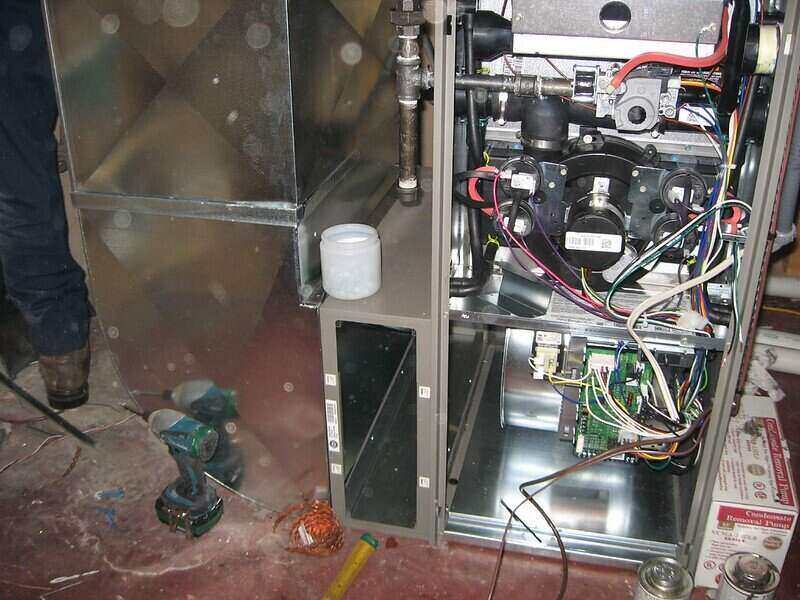 Inside of furnace exposed, with wires