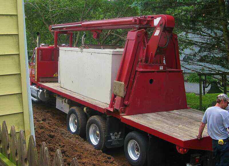 Rectangular septic tank on a flatbed truck