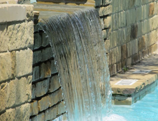 waterfall flowing into pool