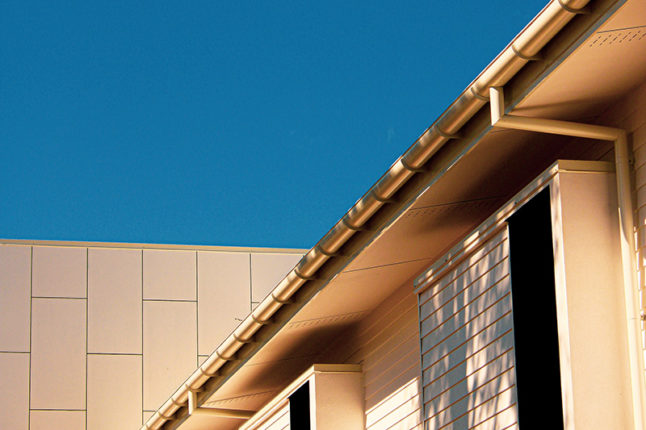 brown concrete building under blue sky during daylight