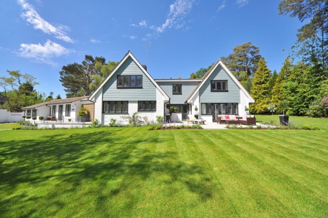 house with freshly mowed lawn