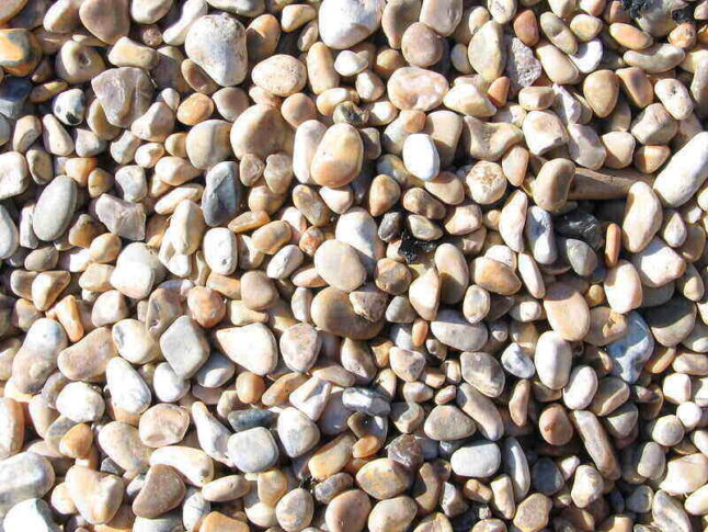 close-up of smooth pea gravel in various colors