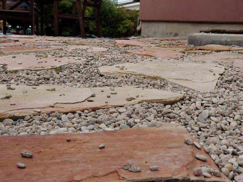 Pea gravel placed between flat walking stones