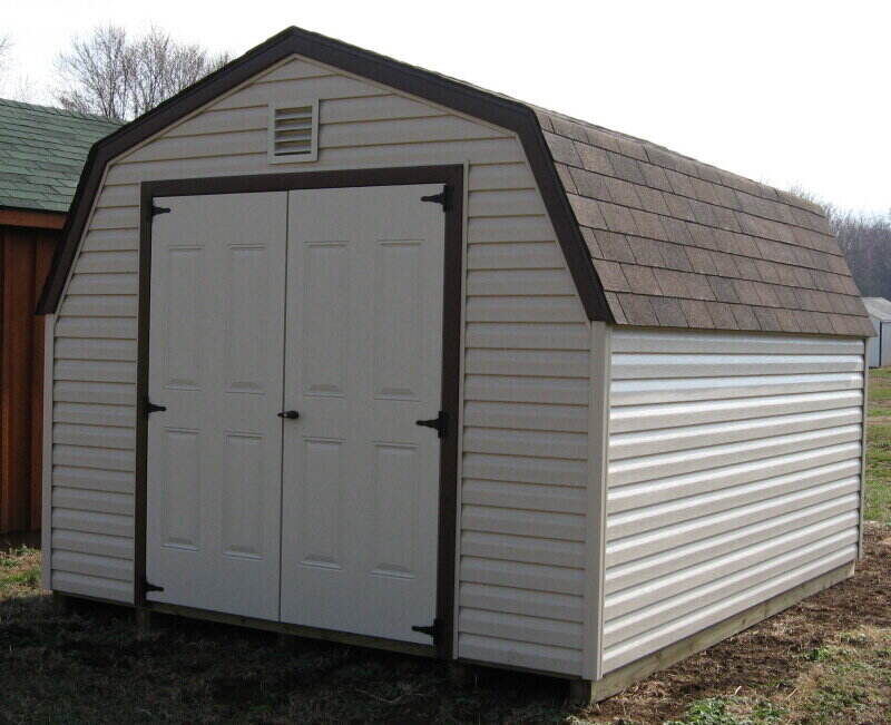 White vinyl shed with double doors