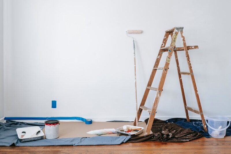 Paint supplies and ladder for interior painting