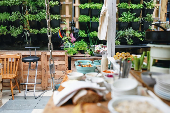 Assorted colored kitchenware on top of outdoor kitchen countertop