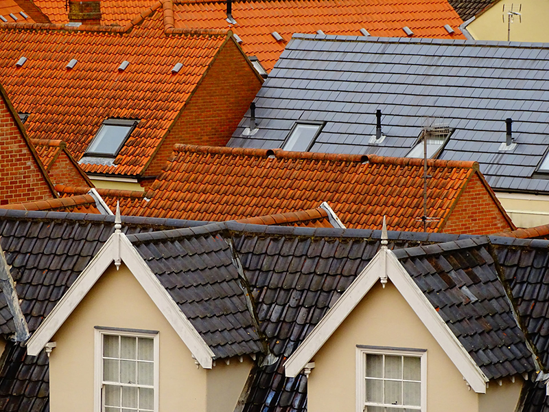 aerial shot of different colored rooftops