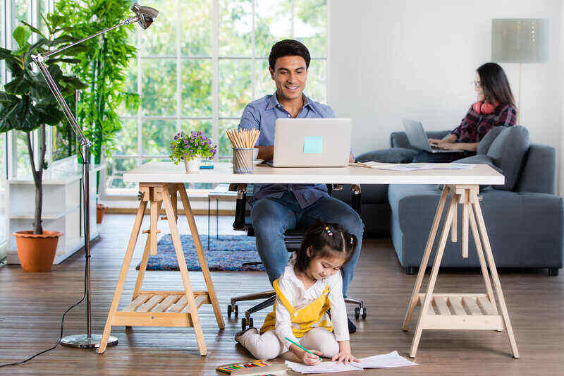 Family Sharing Spacious Room as Work and Play Space