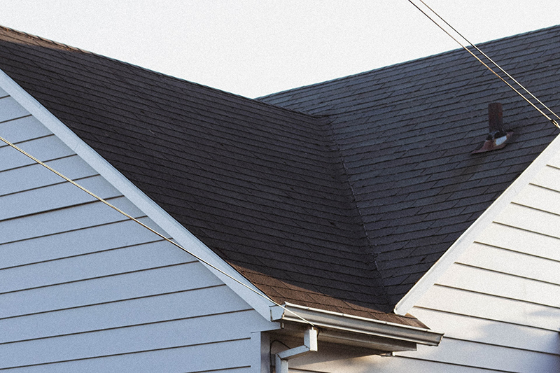 closeup of roofline with asphalt shingles