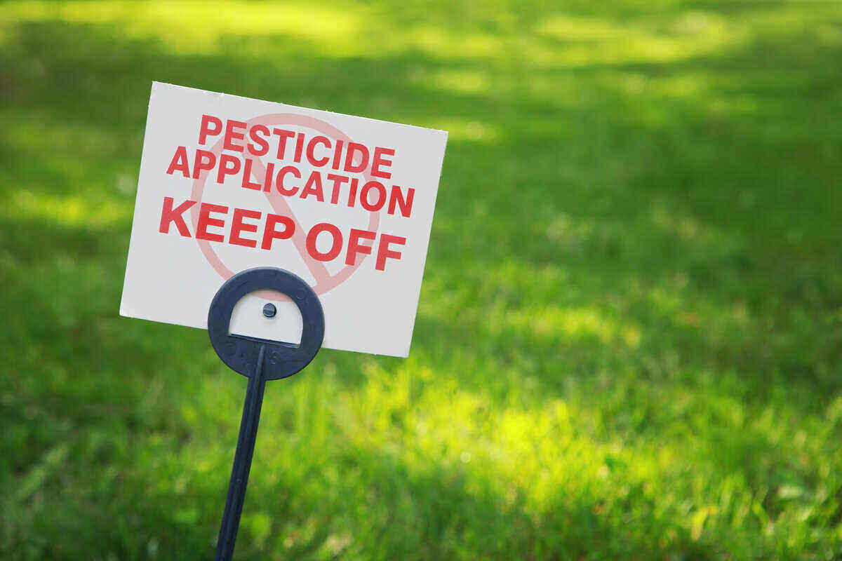 Pesticide application/keep off sign on treated grass