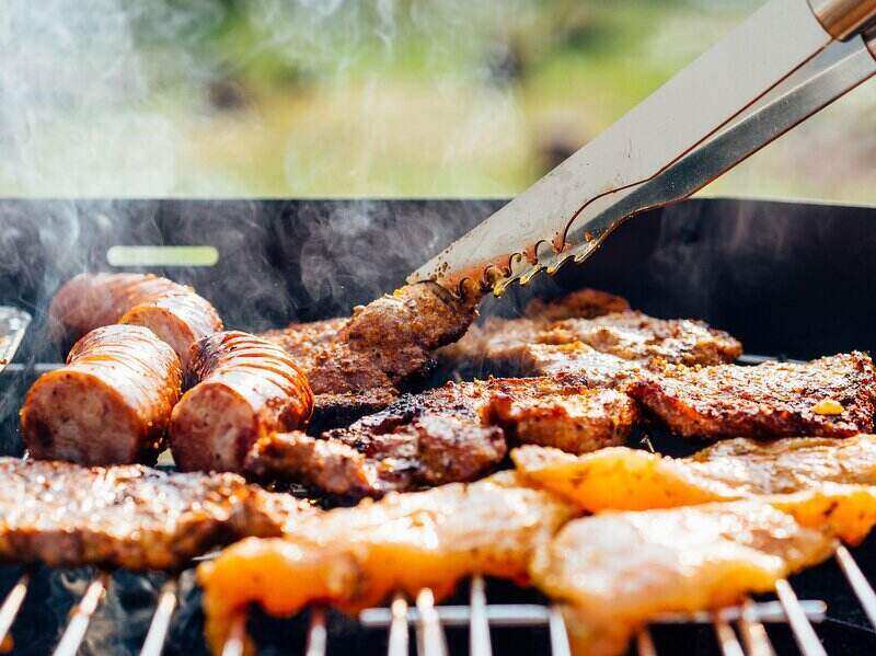 Variety of meats on a hot grill