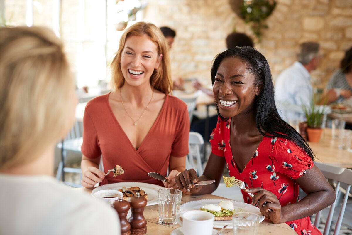 friends smiling at brunch