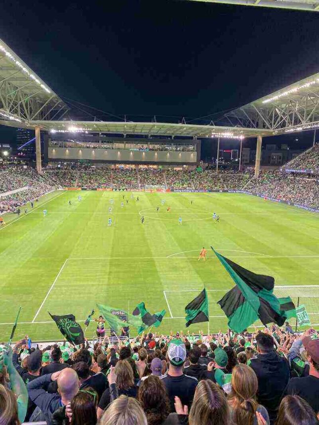 Austin FC soccer stadium photo of the grass and soccer action and big-screen TV