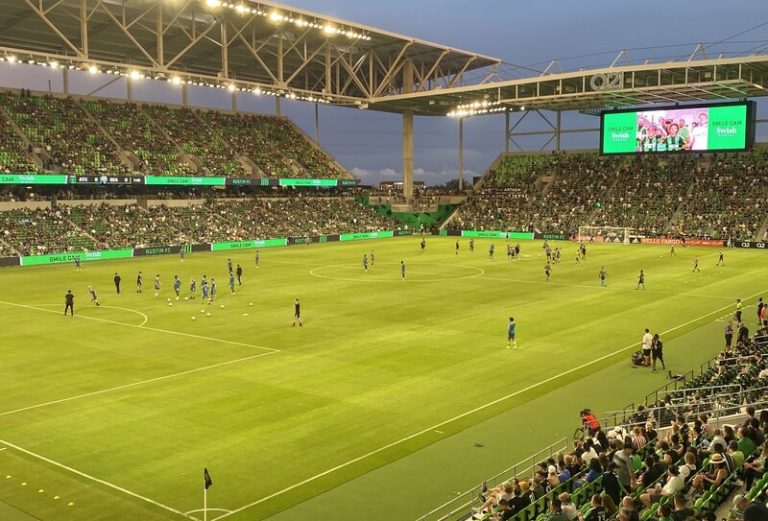 Austin FC soccer stadium photo of the grass and soccer action and big-screen TV
