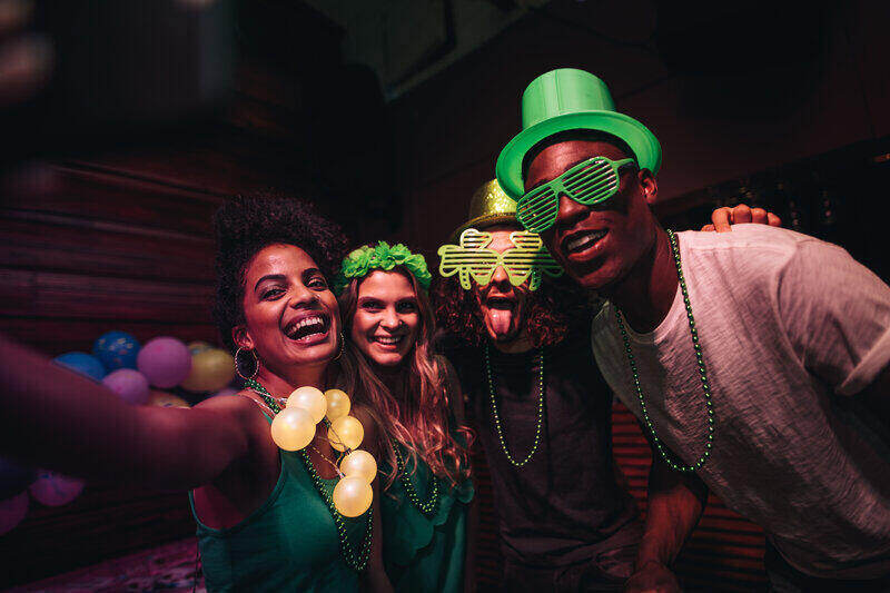 Image showing a group of friends wearing St. Patrick's day-themed attire to celebrate the holiday