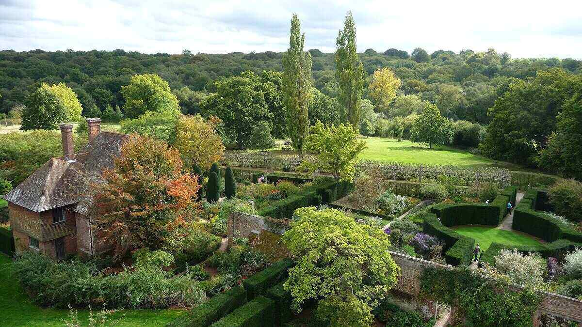 Sissinghurst Castle's lush, green landscape of trees, shrubs, and gardens