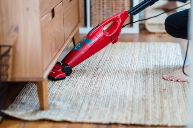 Vacuuming under dresser - Getting Rid  of Bed Bugs