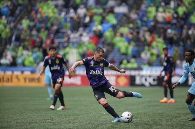 Seattle Sounders midfielder Nicolas Lodeiro prepares to kick the ball at Lumen Field during a match May 15, 2022