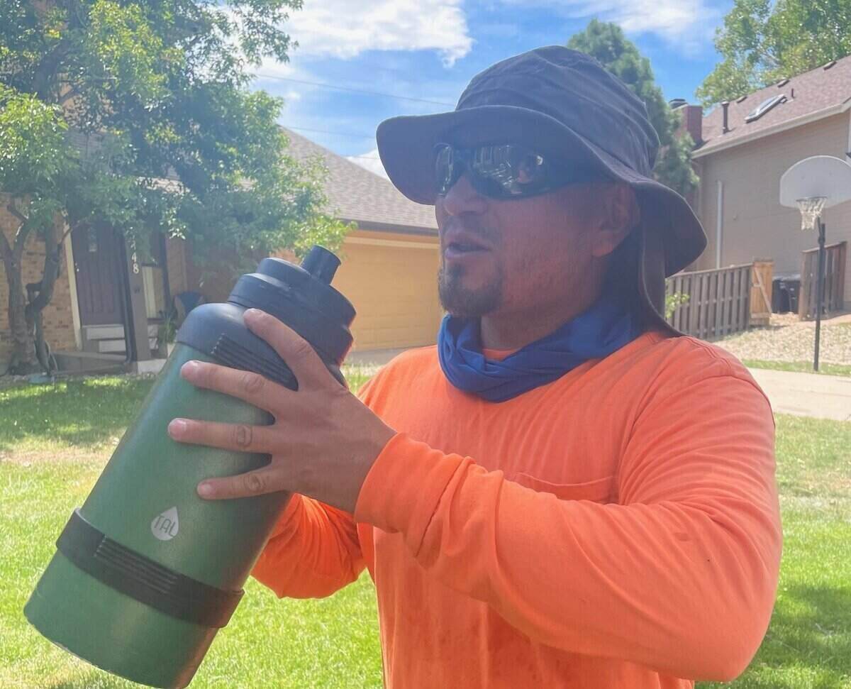 LawnStarter pro Jesse Nunez beats the heat with ice cold water