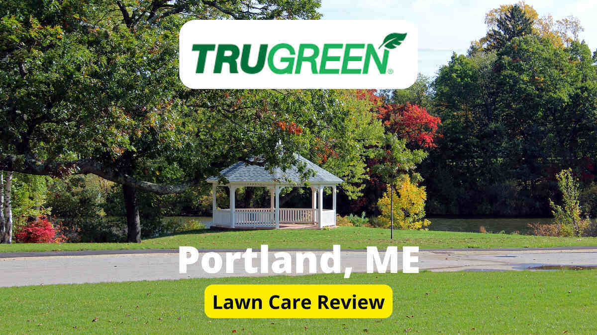 Text: Trugreen in Portland, ME | Background Image: Lawn in front of a hut