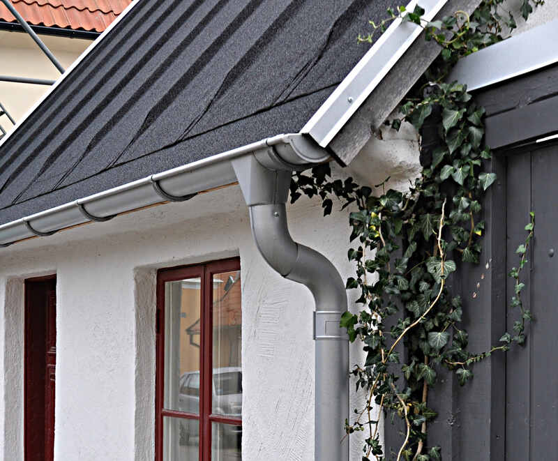 image of a gutter along house wall