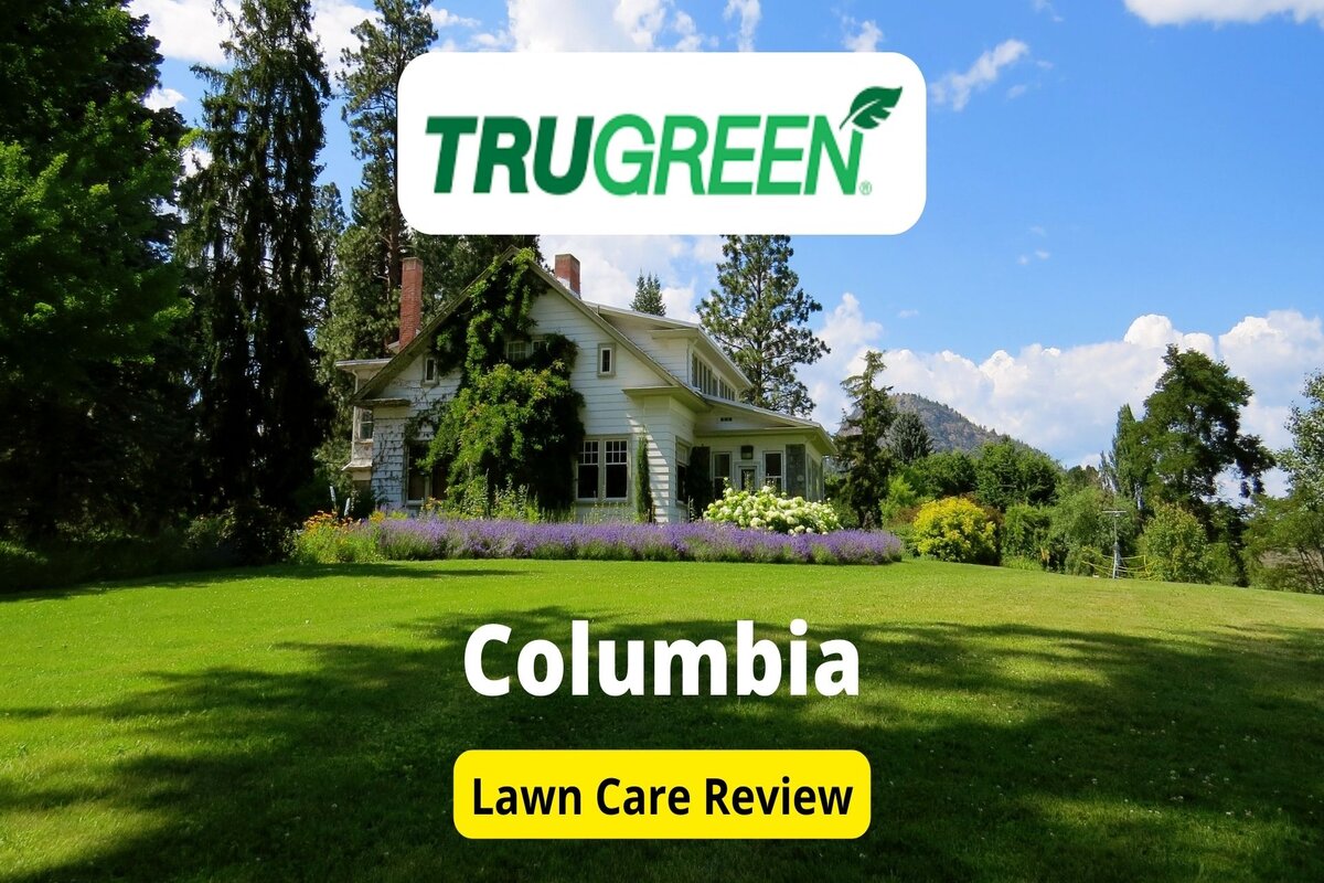 Text: Trugreen in Colmbia | Background Image: Green Fields in front of a house