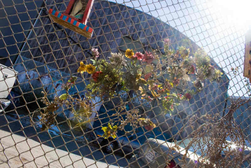Flowers decorations on a chain link fence