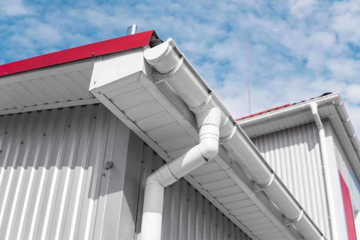 Text: Part of Gutter System | Background Image: Gutter side of roof of silver house