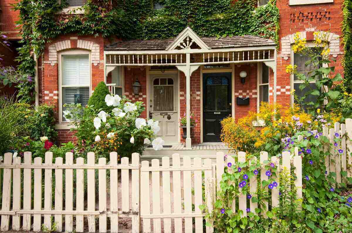 white picket fence in front of a house