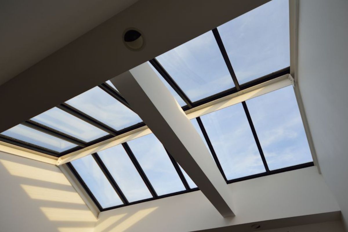 Text: Skylight Cost | Background Image: Skylight installed in roof