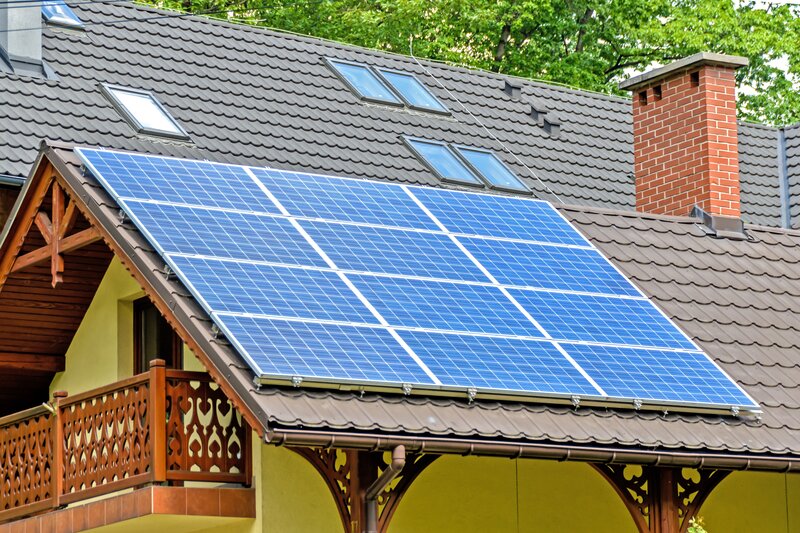 Background Image: Solar Panel on the roof of a house