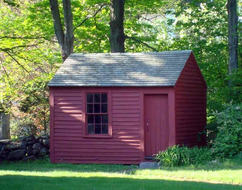  A she shed under tree in the backyard of lawn