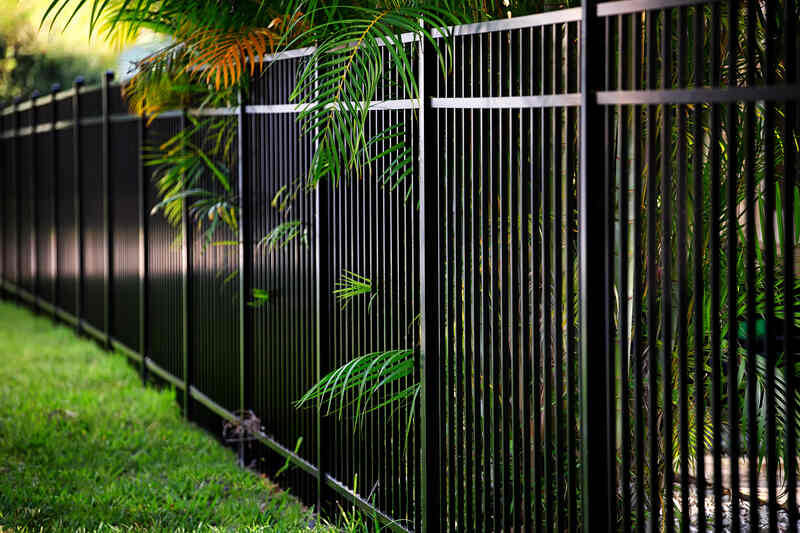 A black aluminium fence