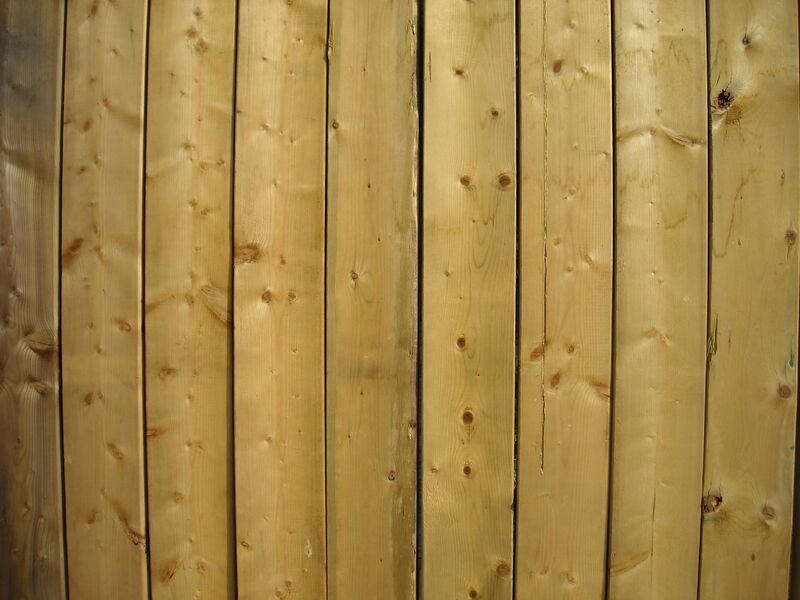 A beautiful wooden board on board fence