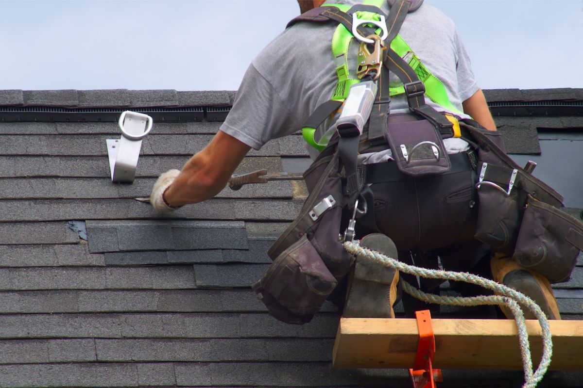 Man Repairing Balck Color Roof