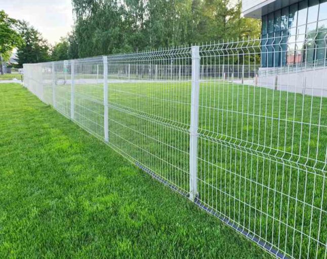 A beautiful metal fence of a lawn.
