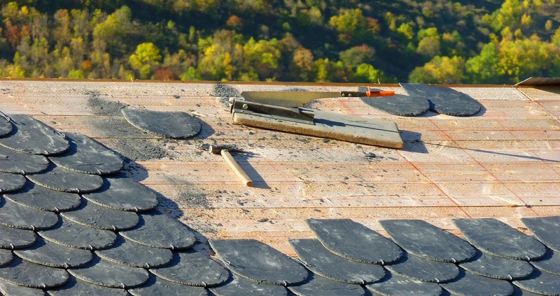 A house with slate roof being built